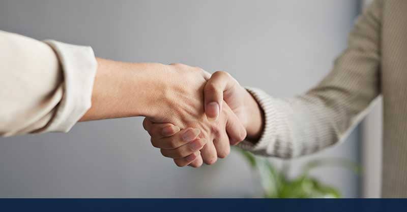 two people shaking hands