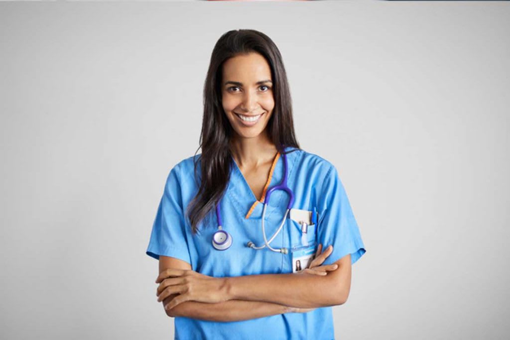 portrait of a nurse crossing her arms and smiling
