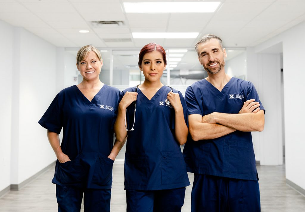 three nurses in hallway