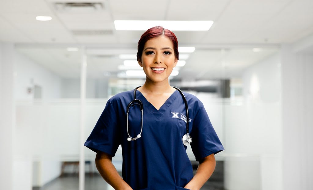 nursing student standing in hallway