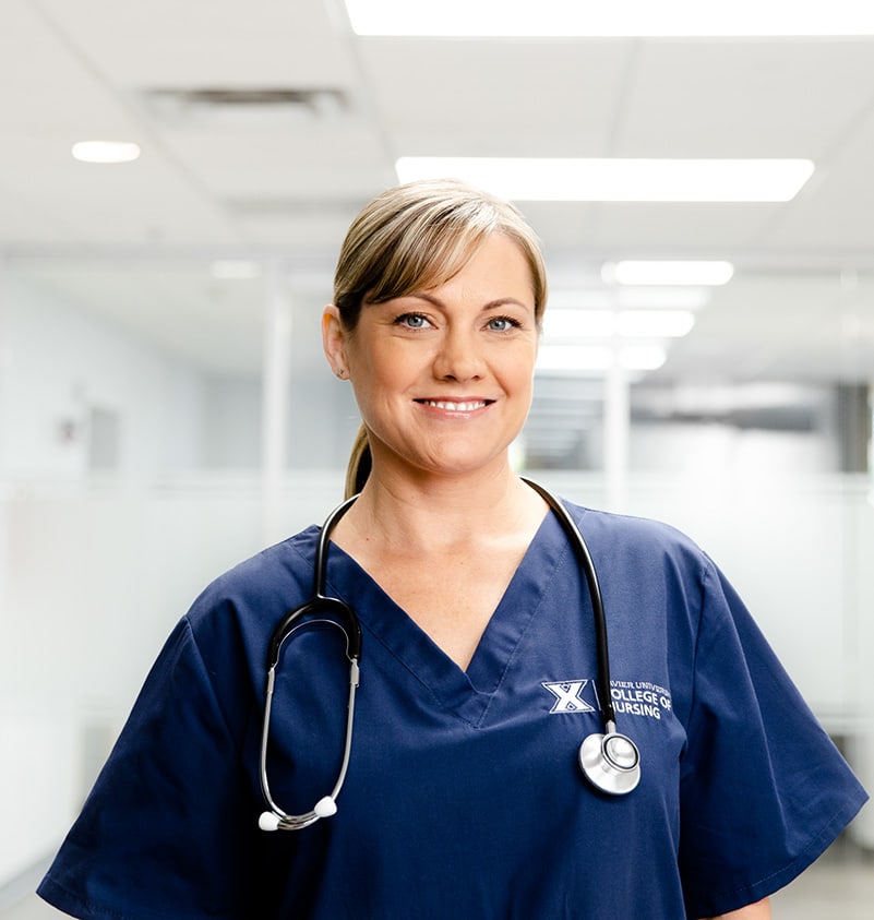 nurse smiling in hallway