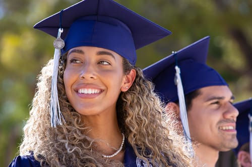 Student in graduation cap smiling