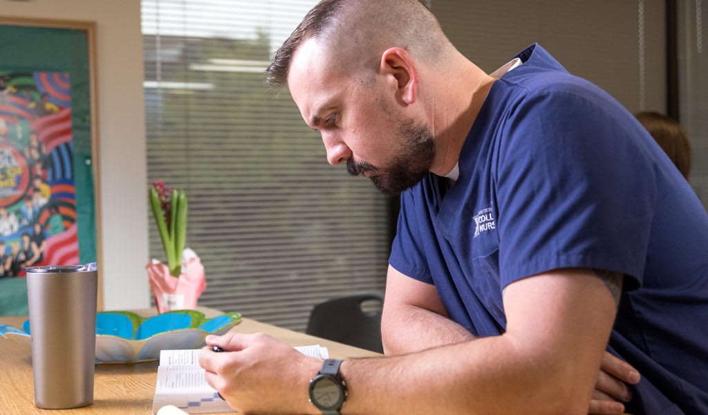 nurse studying at table