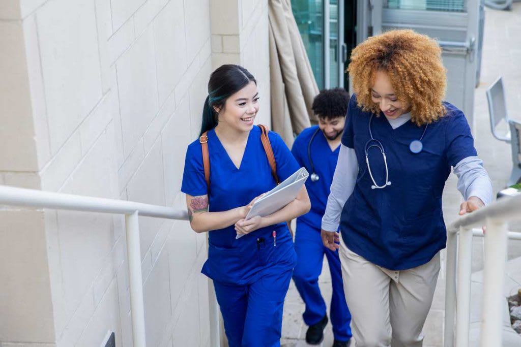 nurses walking up stairs