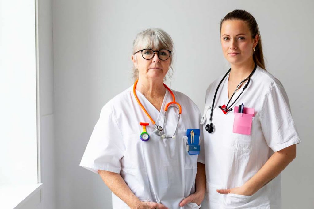 two nurses standing next to each other