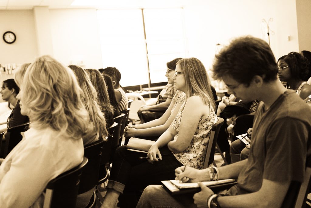 People sitting in rows of chairs