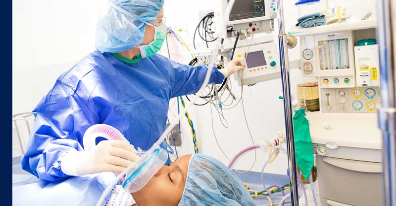 nurse giving patient anesthesia