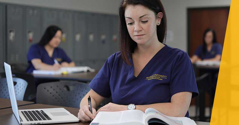 Marian University students sitting at desks studying