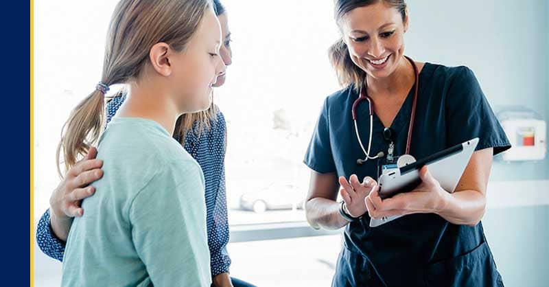 Nurse looking at clipboard with patients