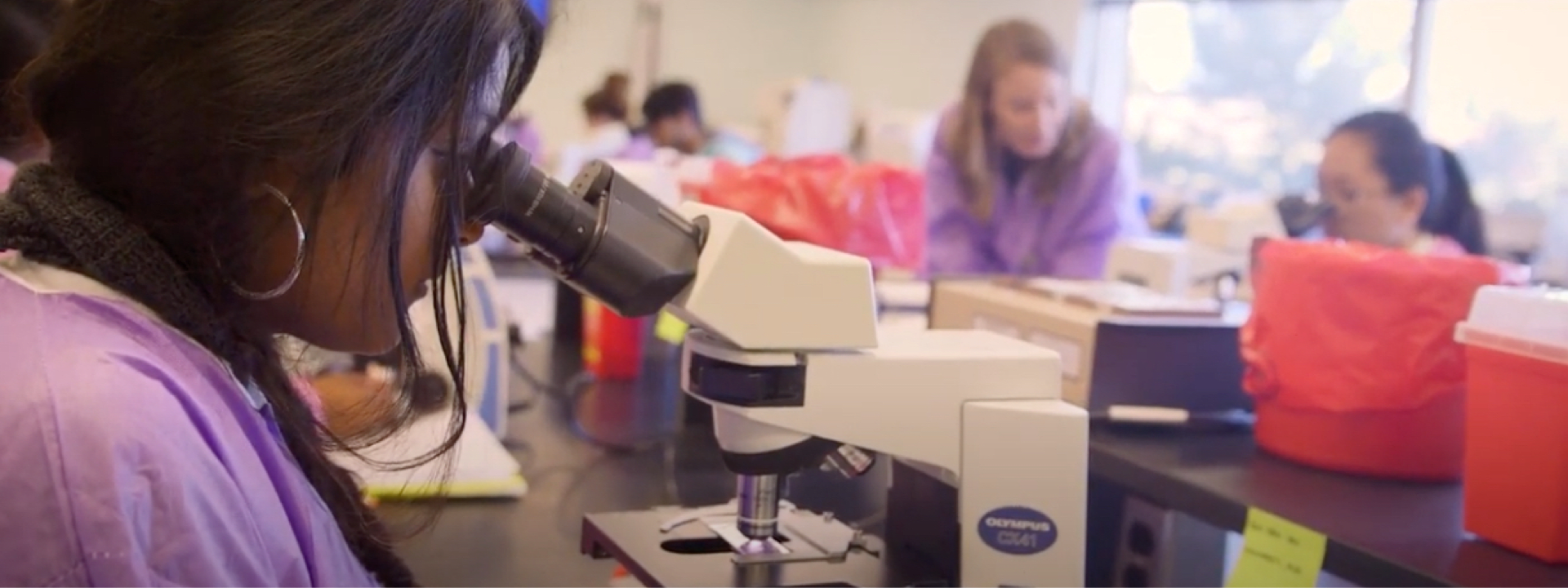 Person using a microscope