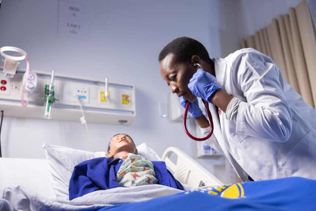 nursing student workin in sim lab