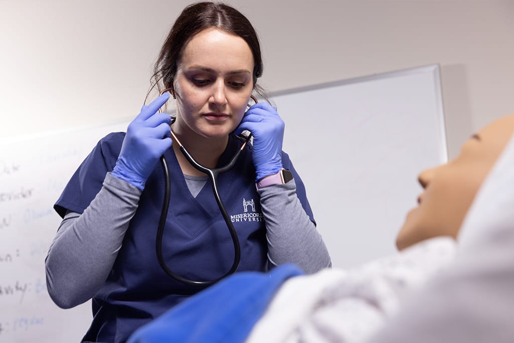 Misericordia nursing student using stethoscope