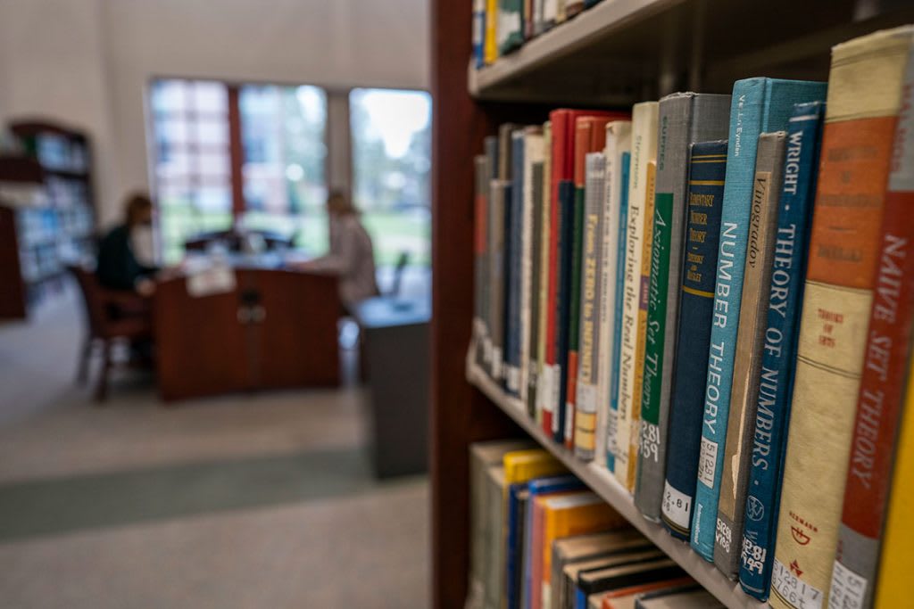 Books on a bookshelf at Bellarmine University