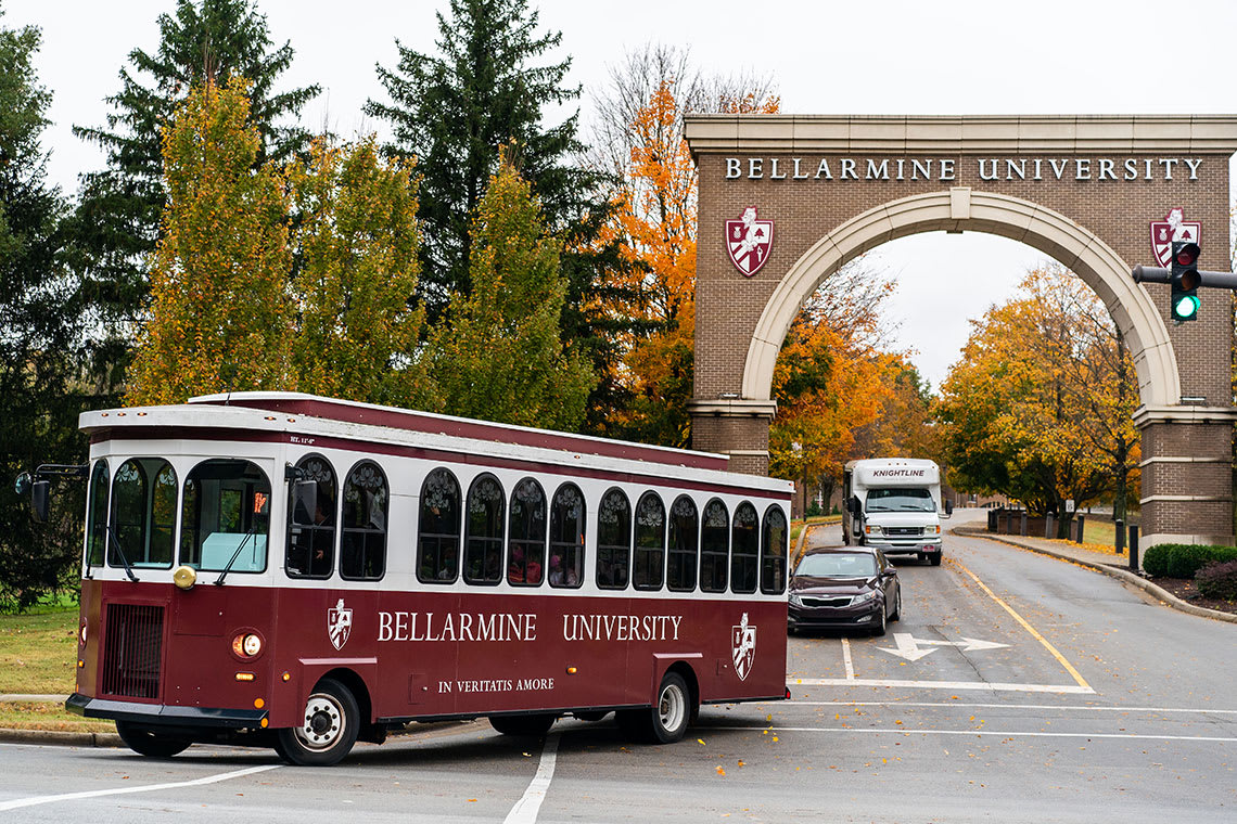 Bellarmine University trolley bus driving near entrance