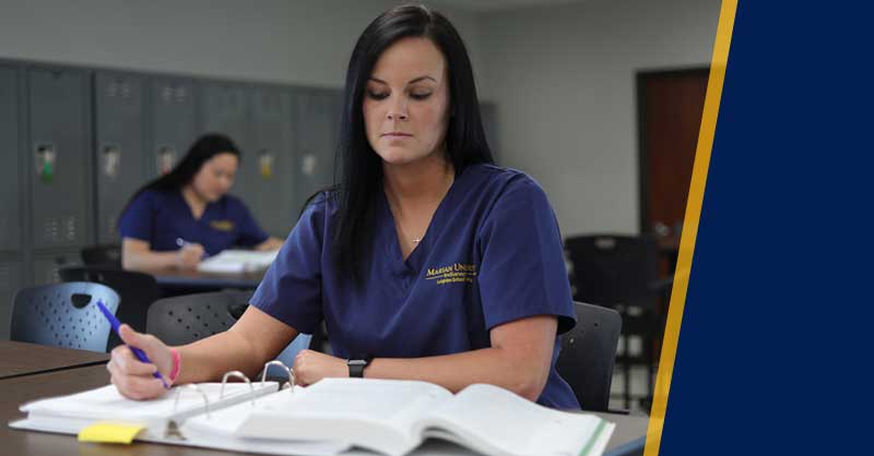 Marian University ABSN students sitting at desks studying