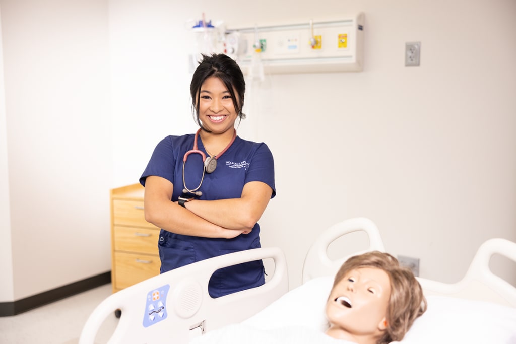 smiling nursing student crossing arms