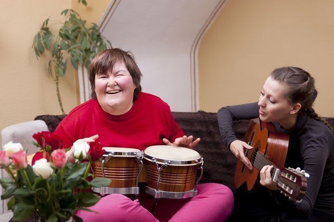 Women playing instruments on couch