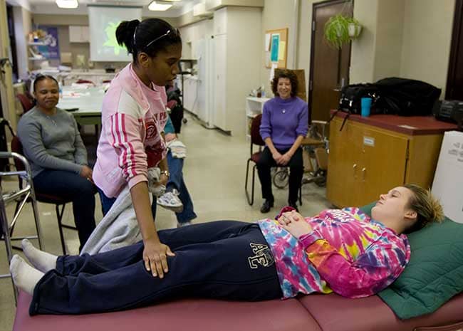 OTA students practicing skills in skills lab