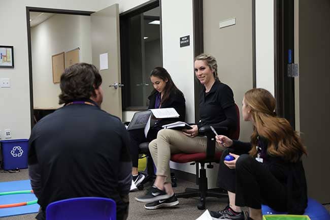 OTA school students in classroom studying together