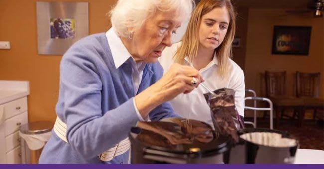 OTA assisting elderly woman with coffee pot