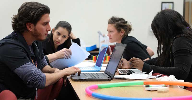 OTA students sitting at table studying