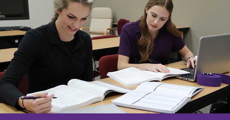 Two ota students studying