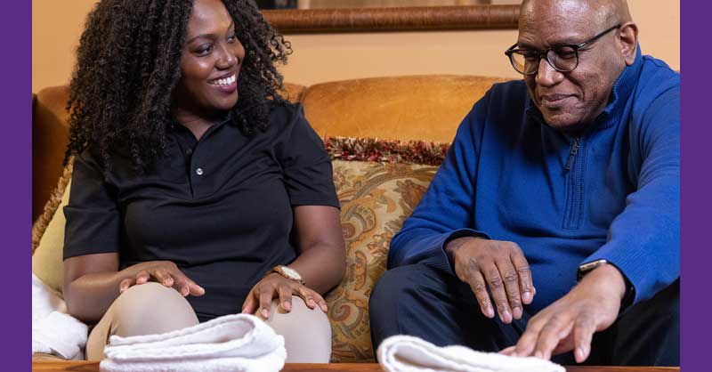 Man and woman sitting on a couch together