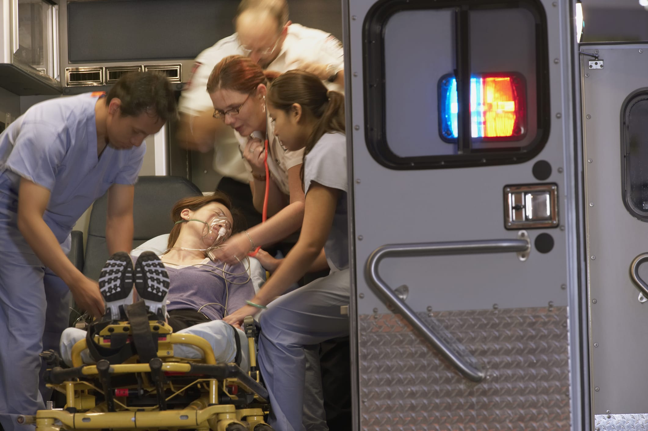 patient being put into an ambulance