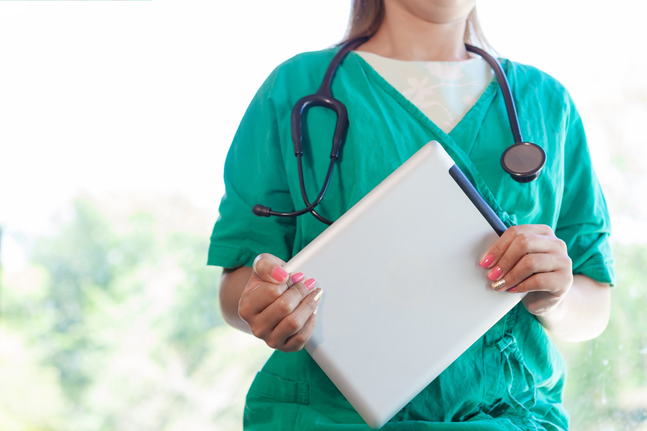 Doctor with tablet computer.