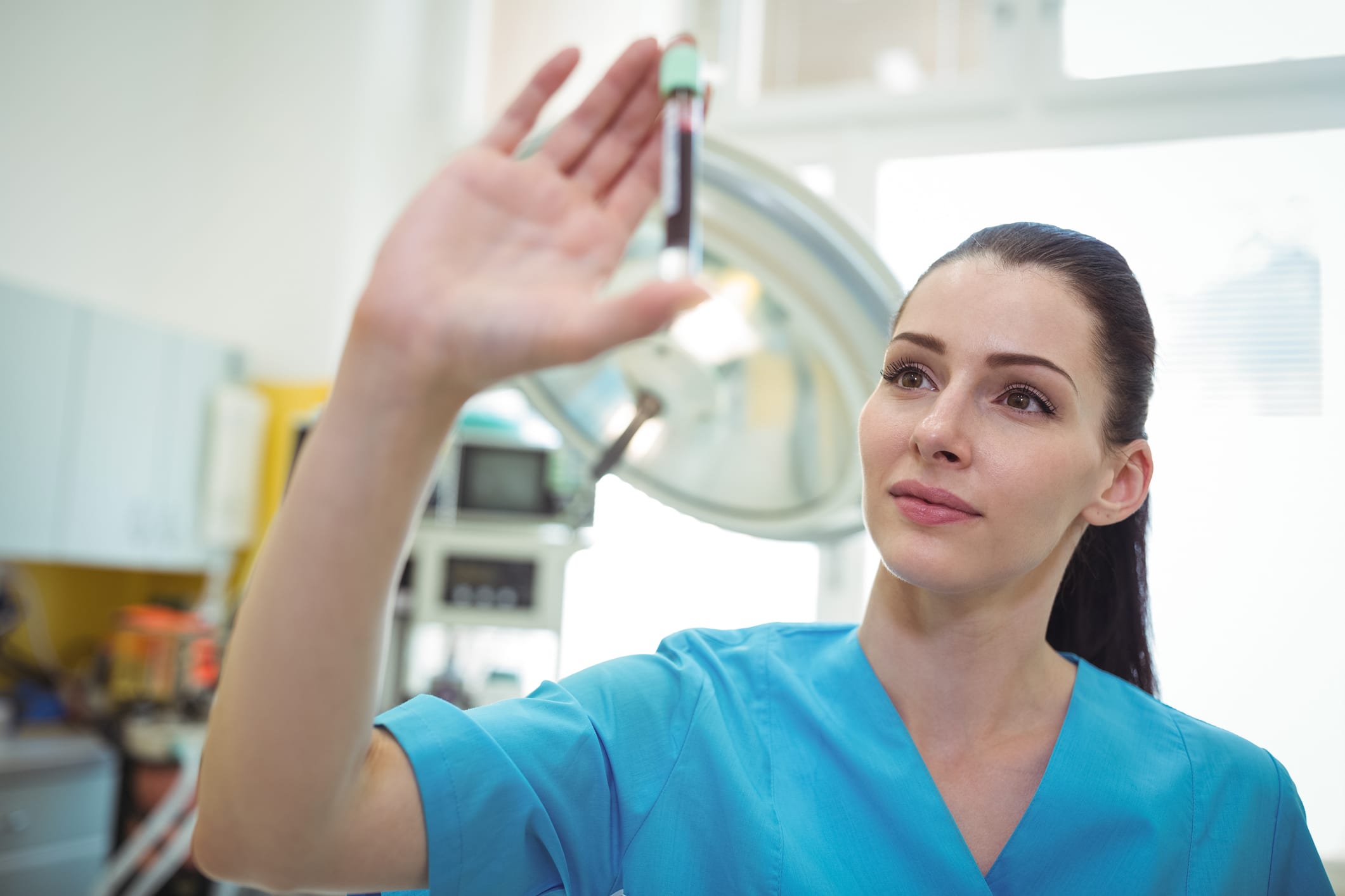 Nurse looking at the blood sample