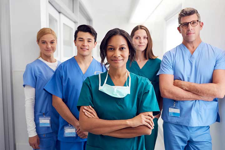 team of nurses standing and posing