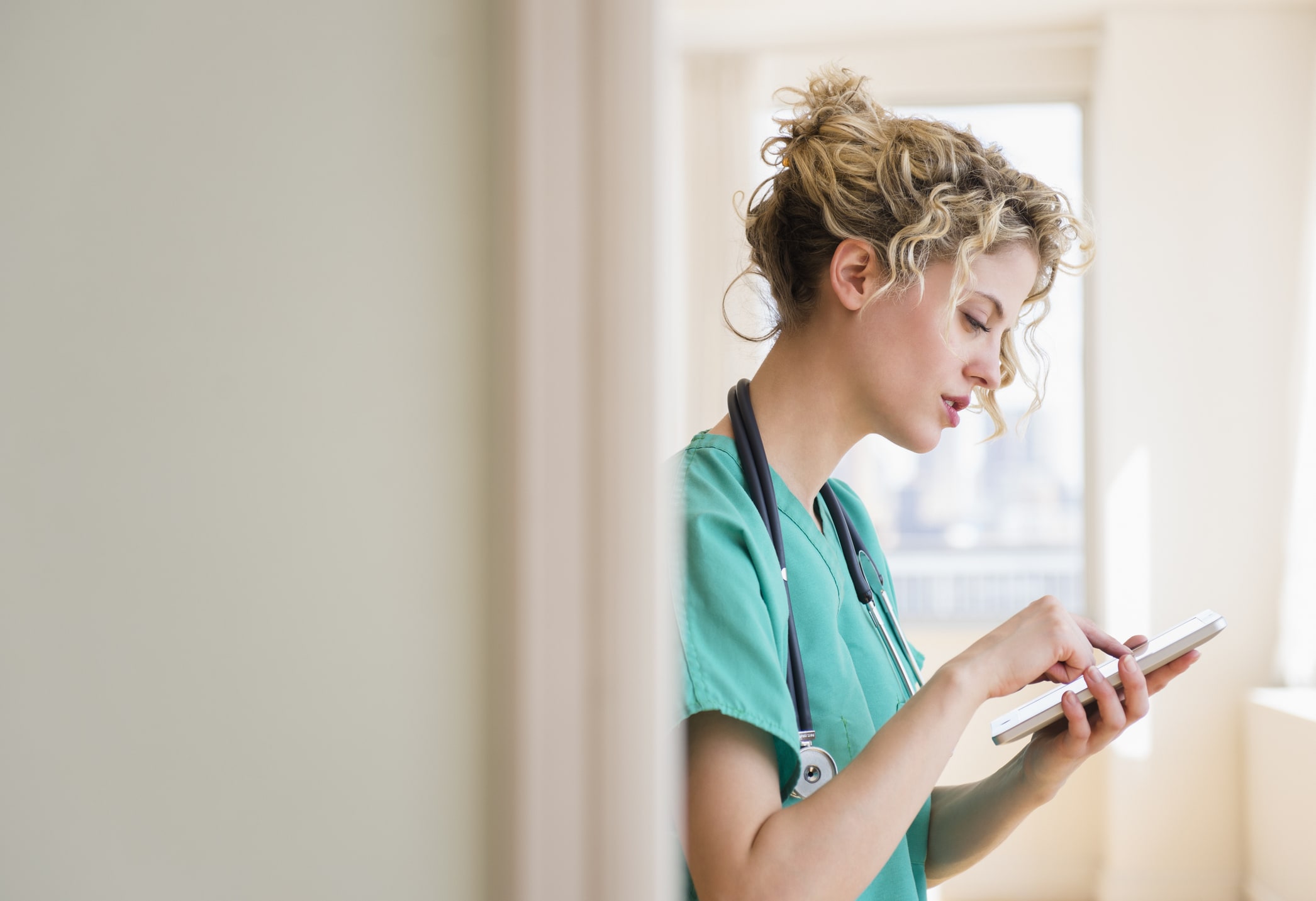 Doctor using digital tablet