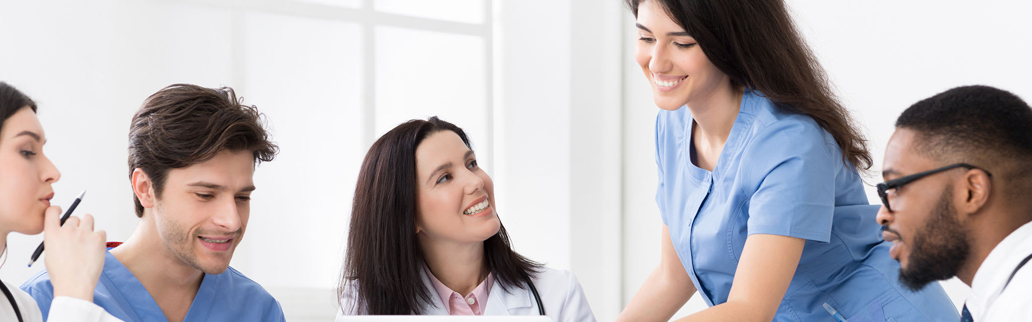 nurses talking at table together