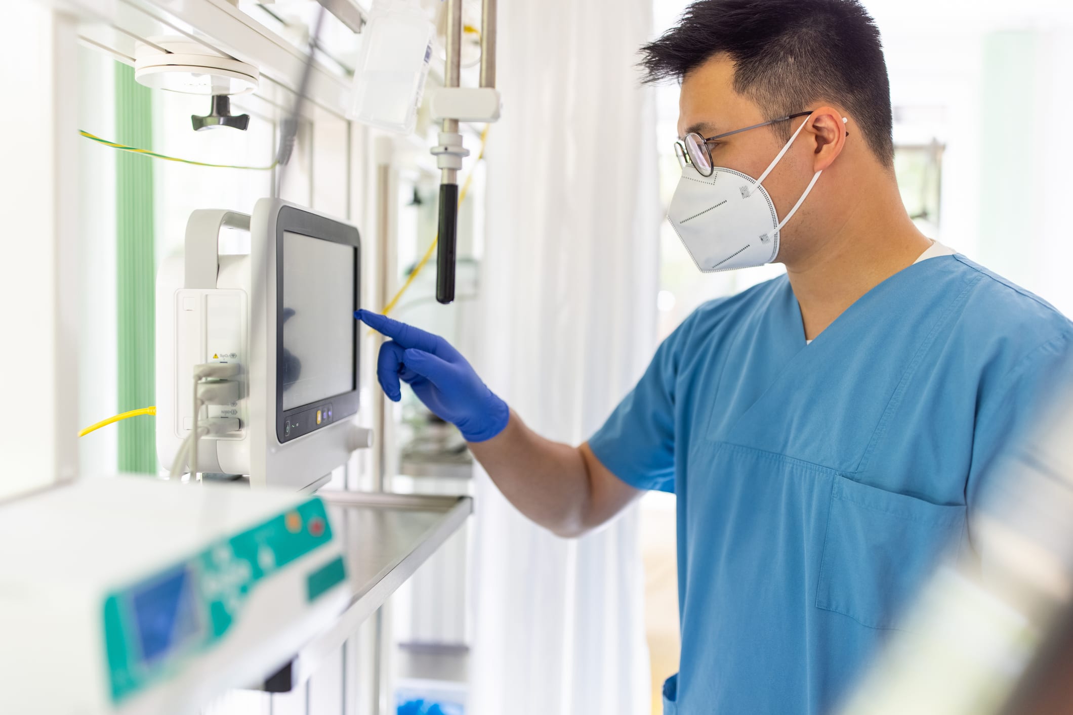 nurse using electronic equipment in hospital