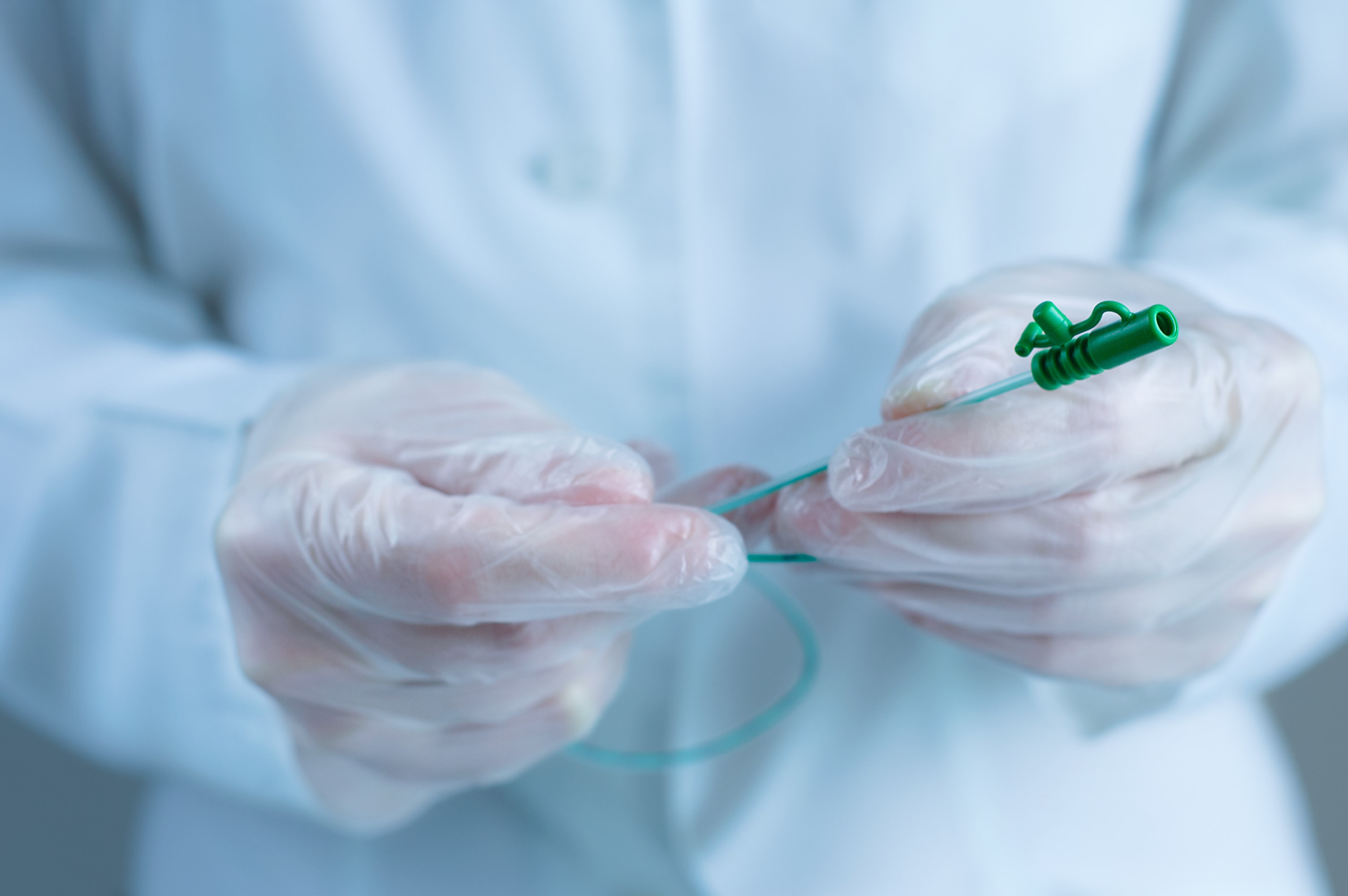 urology nurse holding tube