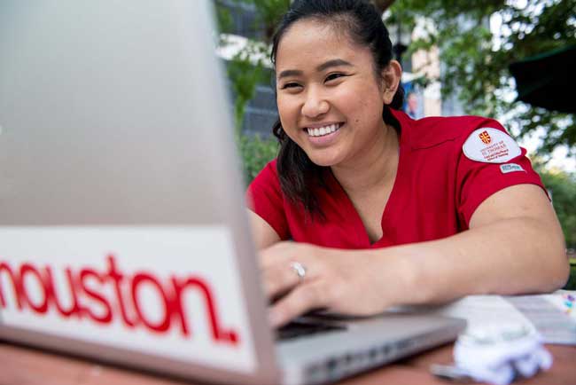 University of St. Thomas nursing student using computer