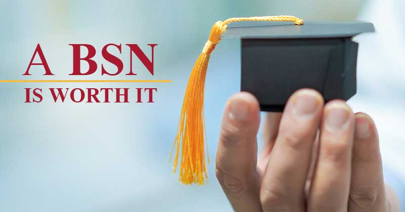A BSN is Worth It - hand holding tiny grad cap