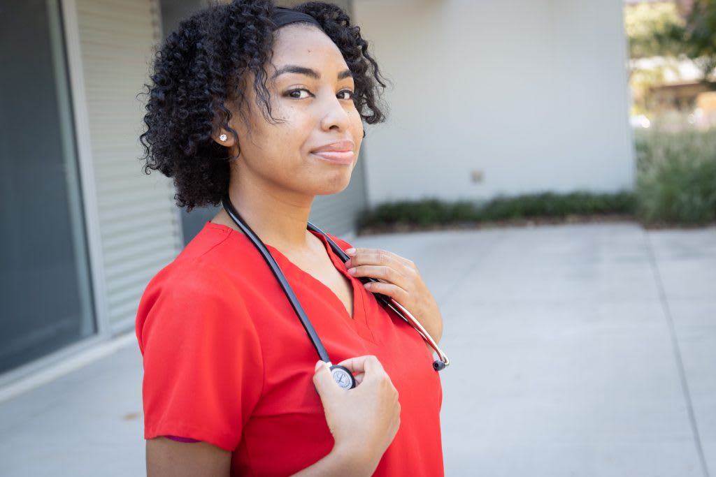 nursing student posing outside with stethoscope