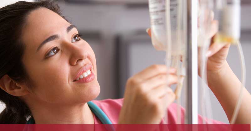 nurse fixing an IV bag