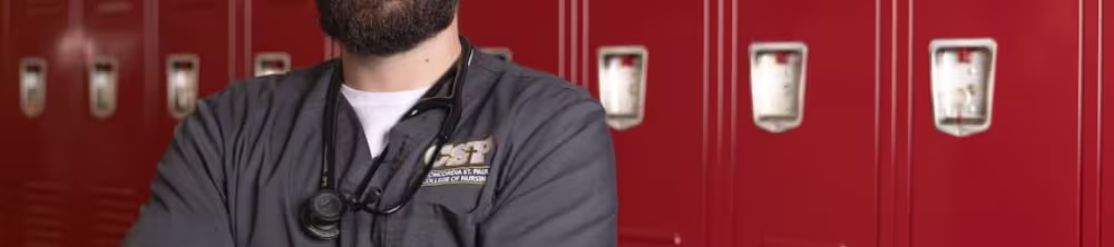 Nurse posing in front of lockers