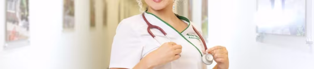 Nurse posing at the end of a hall