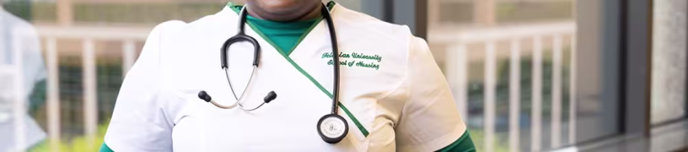 Smiling nursing student in a hallway