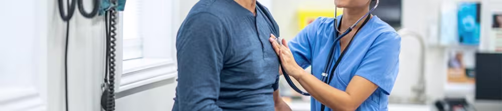 Nurse with patient sitting on table