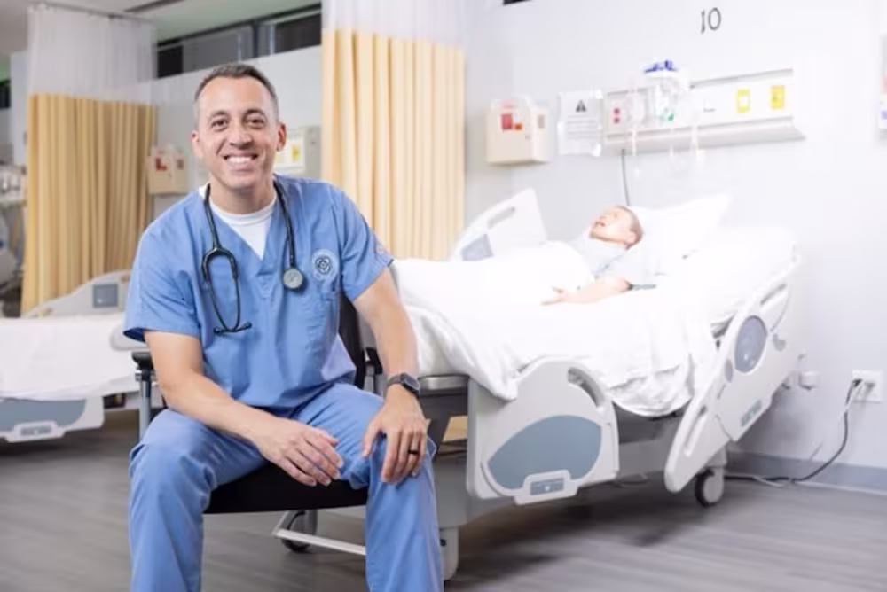 NDMU nursing student sitting in a sim lab