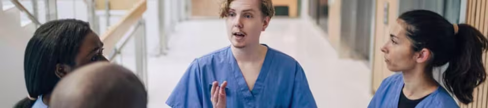 nurses speaking in hallway