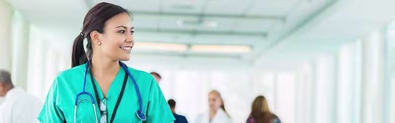 Nurse walking through hallway
