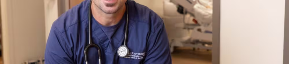 Nurse sitting down posing