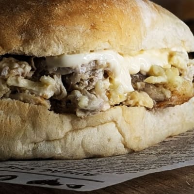 Crispy damper roll, saucy shredded chook, melted cheese & mayo — it's giving comfort food