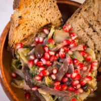 Escarole with pomegranate and anchovies