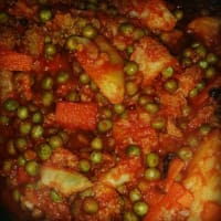 Stew potatoes with peas